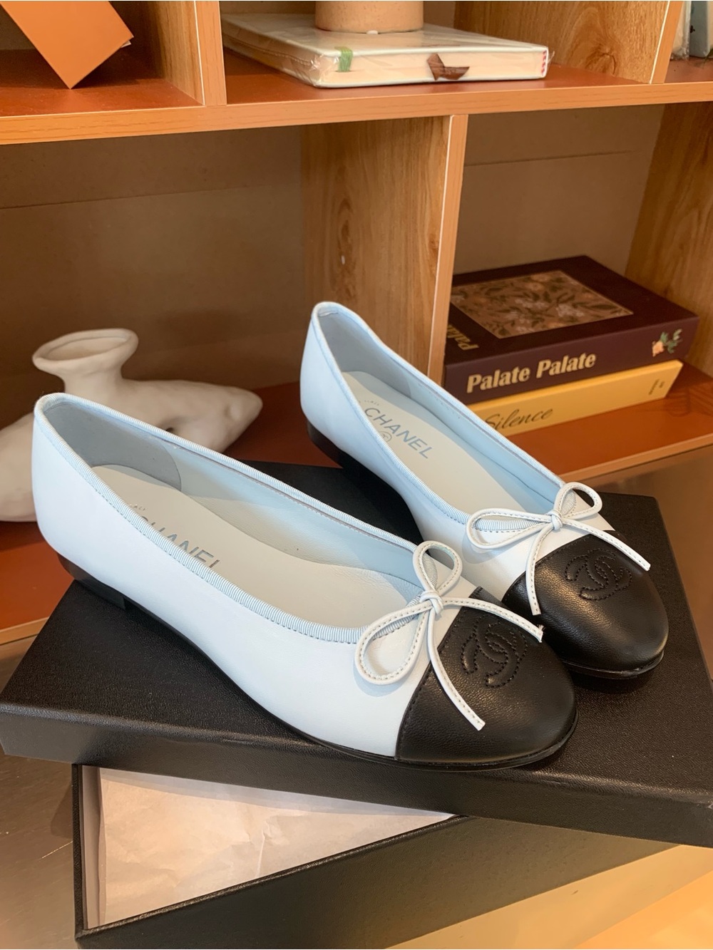 GoodCHANEL Light Blue Leather Ballet Flats with Black Cap Toe and Bow